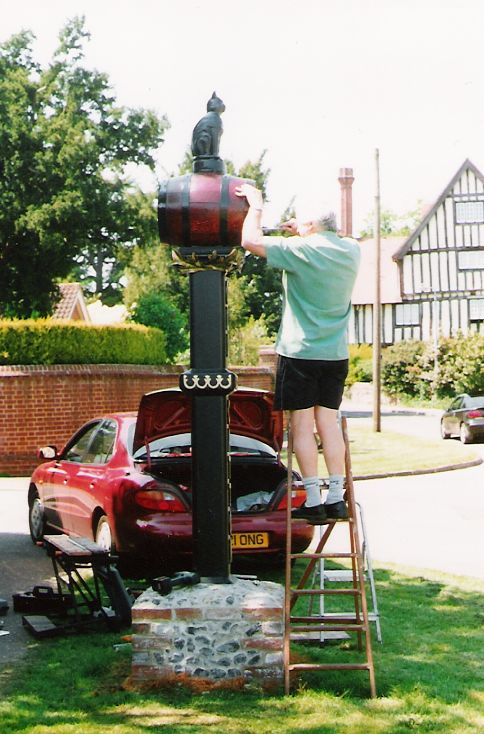 The cat and barrel on its new post