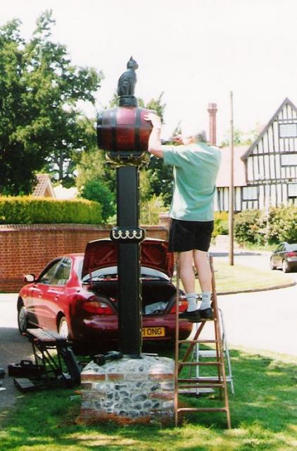 The cat and barrel on its new post